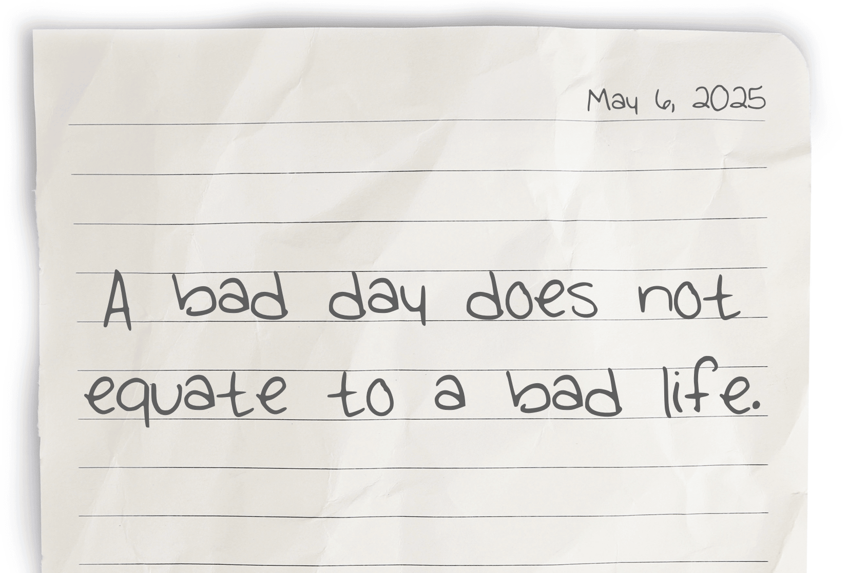 A journaling notebook page dated at the top right corner, featuring today's affirmation, "A bad day does not equate to a bad life," written prominently in the center.