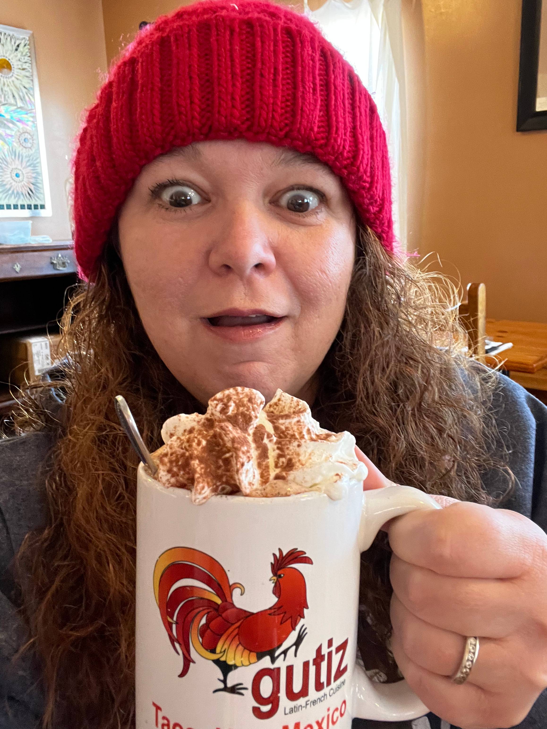 Jodi with a cup of host chocolate. 