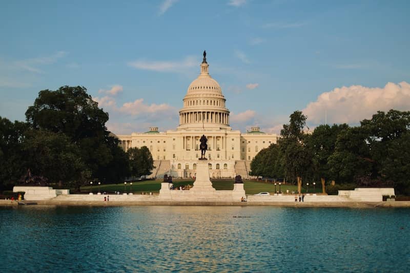The capitol building is reflected in the water