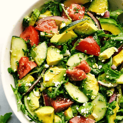 Avocado, tomato and cucumber arugula salad