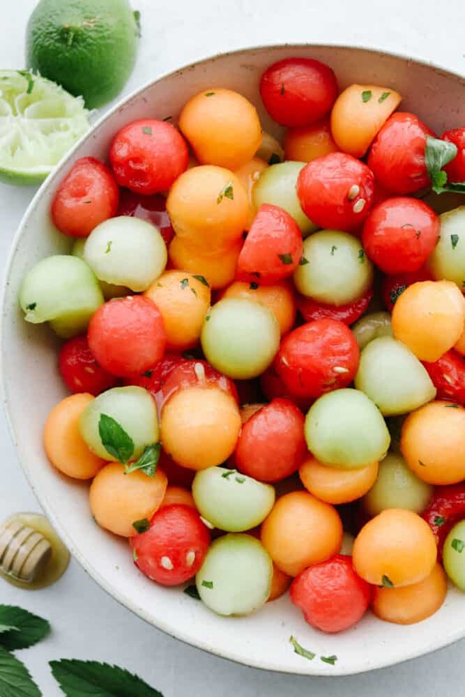 Melon balls in a white bowl. 