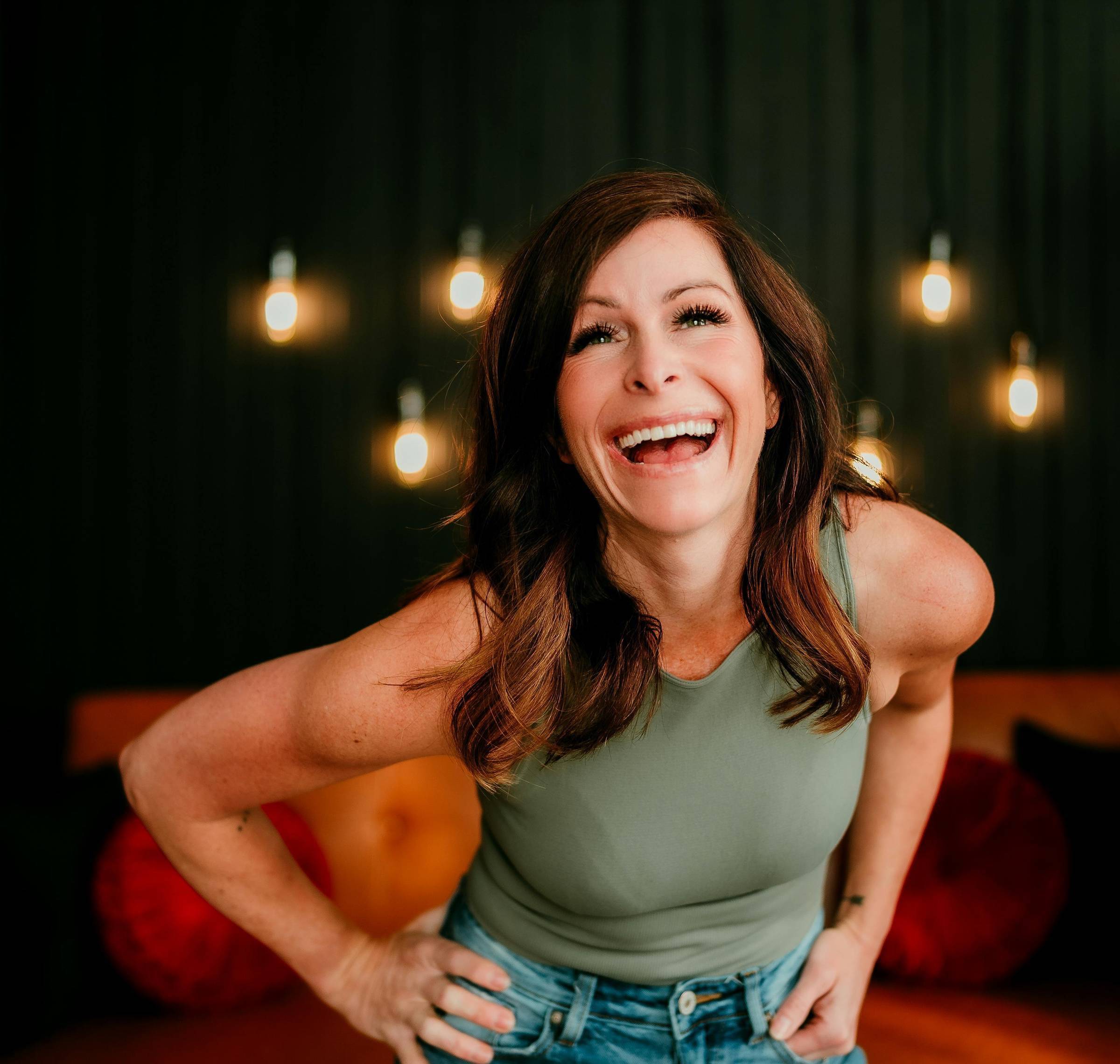 Shannon Kathleen smiling in a warm, natural-light portrait, representing confidence-first dating photography and personal life updates.