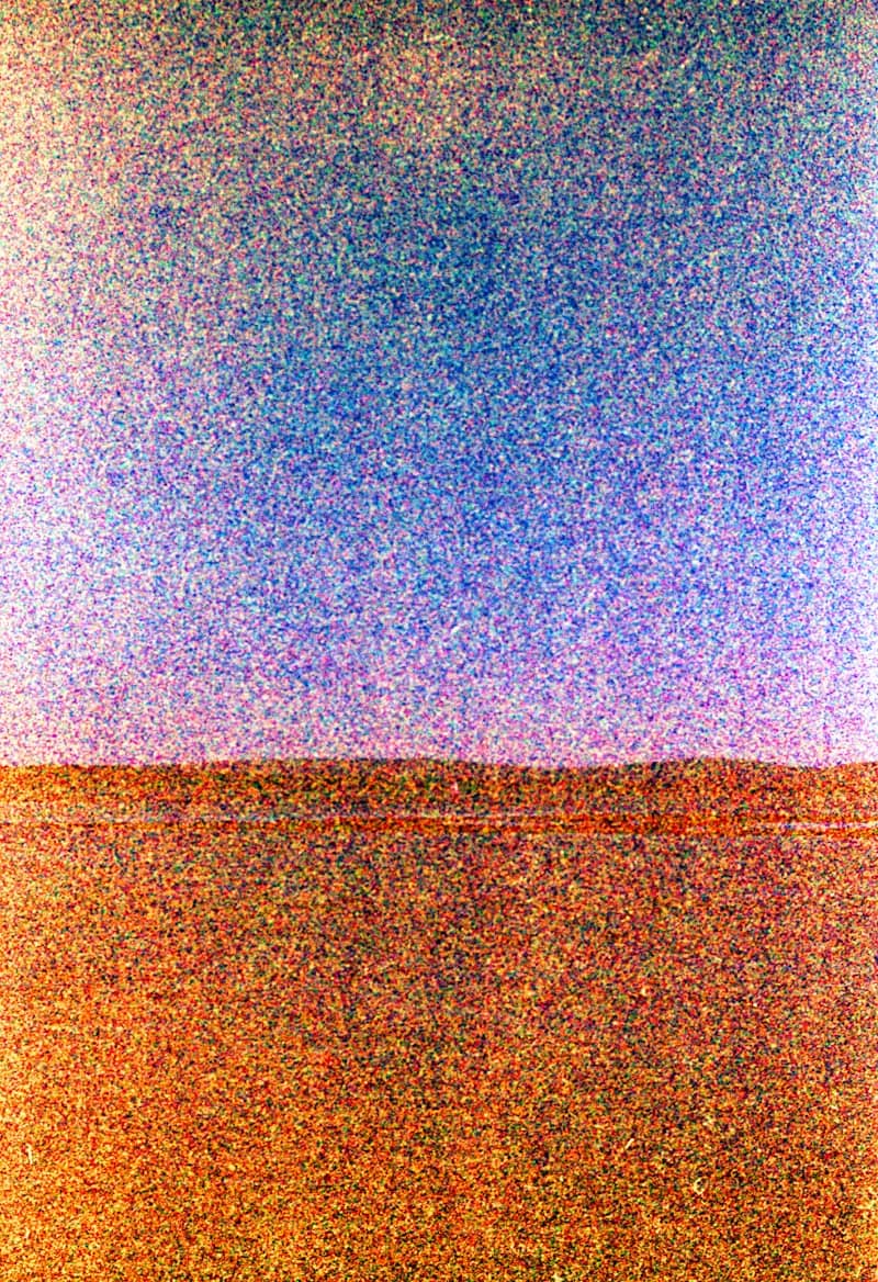 a large television screen with a blue sky in the background