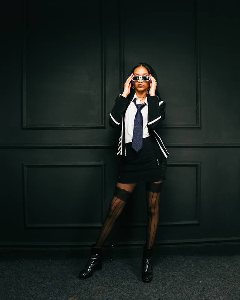 Woman in school uniform with sunglasses