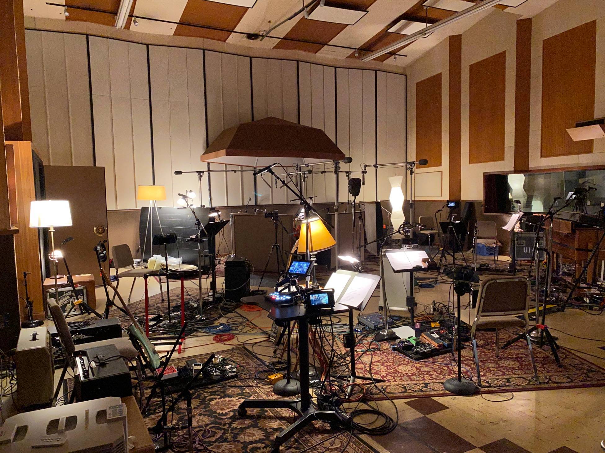 Live room at United Recorders in Hollywood with multiple microphones, music stands, cables, and instruments arranged for a recording session.
