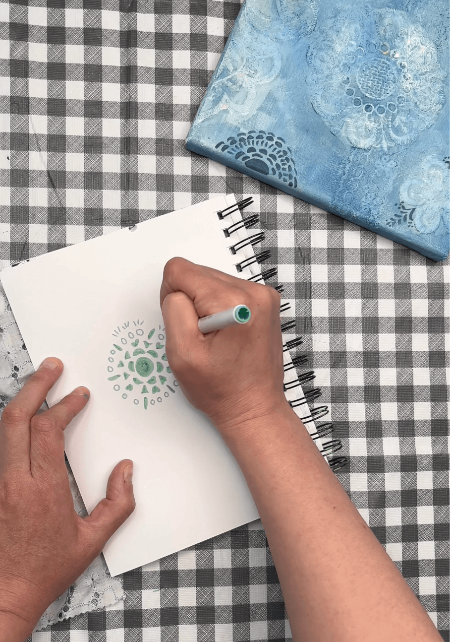 a picture of someone drawing on a pad