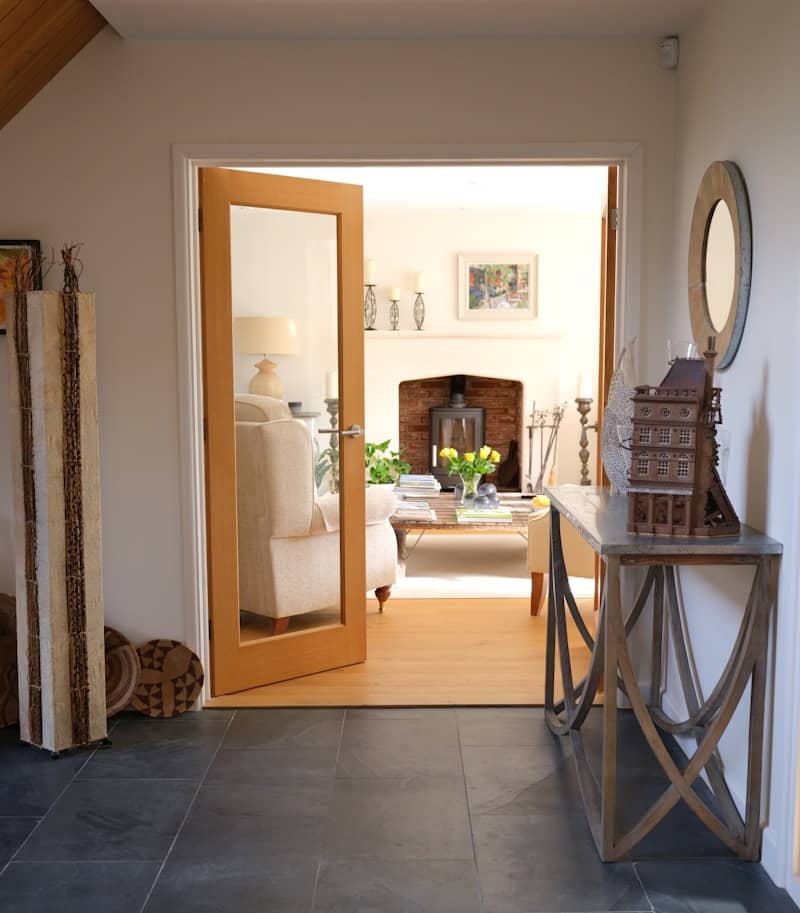Interior view of a well-lit living room through doorway