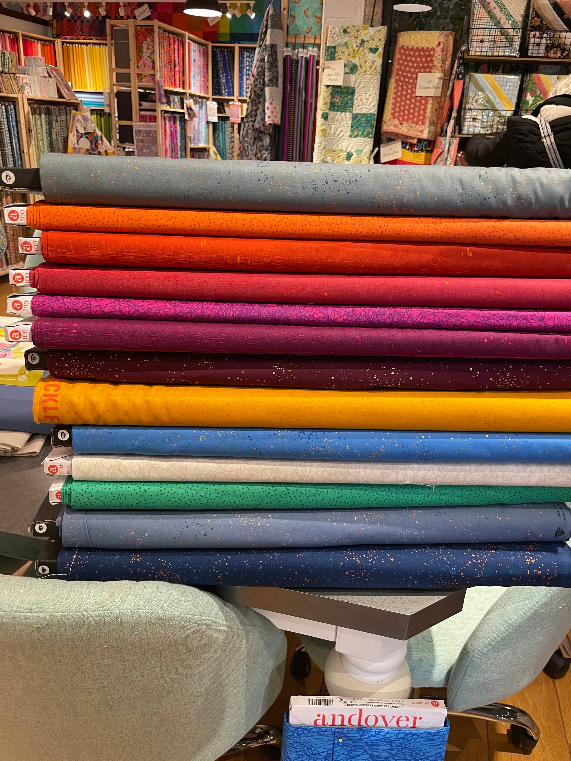 Fabrics stacked up to coordinate my first Sunset Sail Quilt