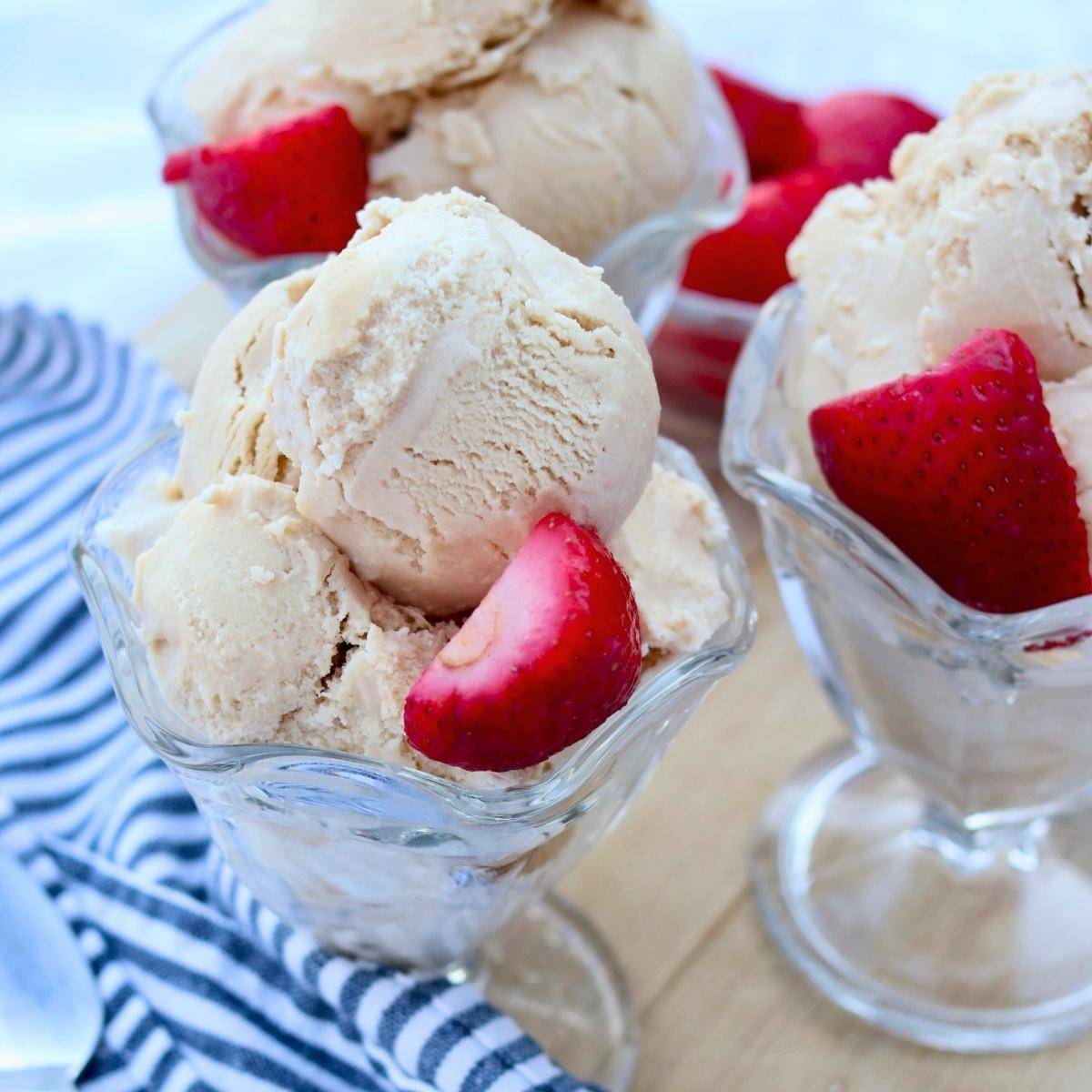 Naturally-sweetened ice cream with fresh strawberries in glass cups.