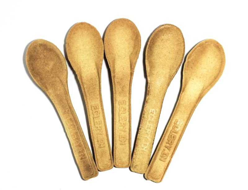 A group of golden spoons sitting on top of each other