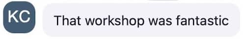 A chat message with a circular icon containing the initials "KC" in white on a dark blue background. The message reads, "That workshop was fantastic."
