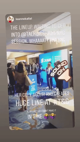 A screenshot of an Instagram Story shows a long line of attendees gathered in a hotel or convention center hallway, all waiting to enter Laura Belgray's session at Atomicon. The overlaid text reads: “THE LINEUP WAITING TO GET INTO @TALKINGSHRIMPNYC SESSION. WHAAAAT? AMAZING.” A large speaker sticker labeled “SOUND ON” points toward the crowd. Additional text at the bottom reads: “HER COPY SELLS! AND CREATES HUGE LINE AT T&C 😍” and “ALSO SAD I DIDN'T MAKE IT IN TIME 🤦‍♀️🤷‍♀️.”