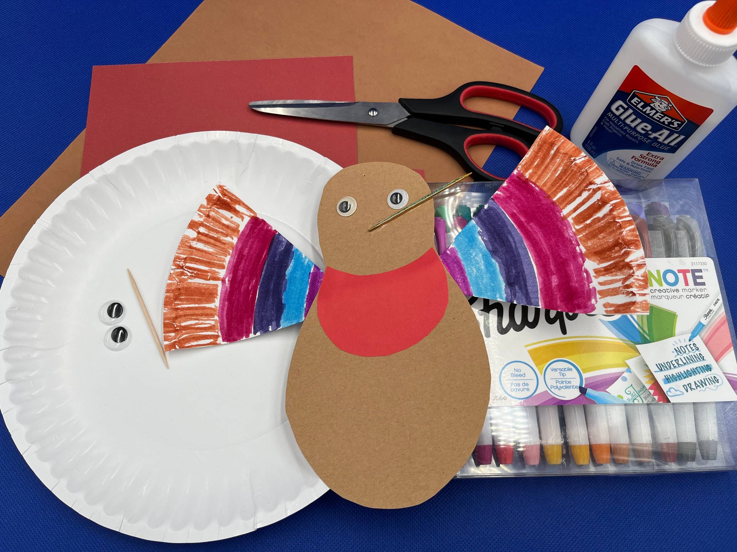 Paper plate hummingbird and all the supplies needed to make it.