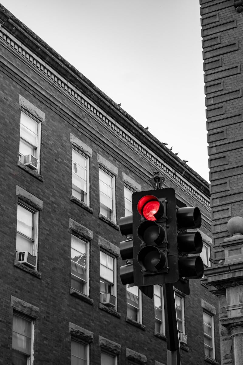 black traffic light on red stop light
