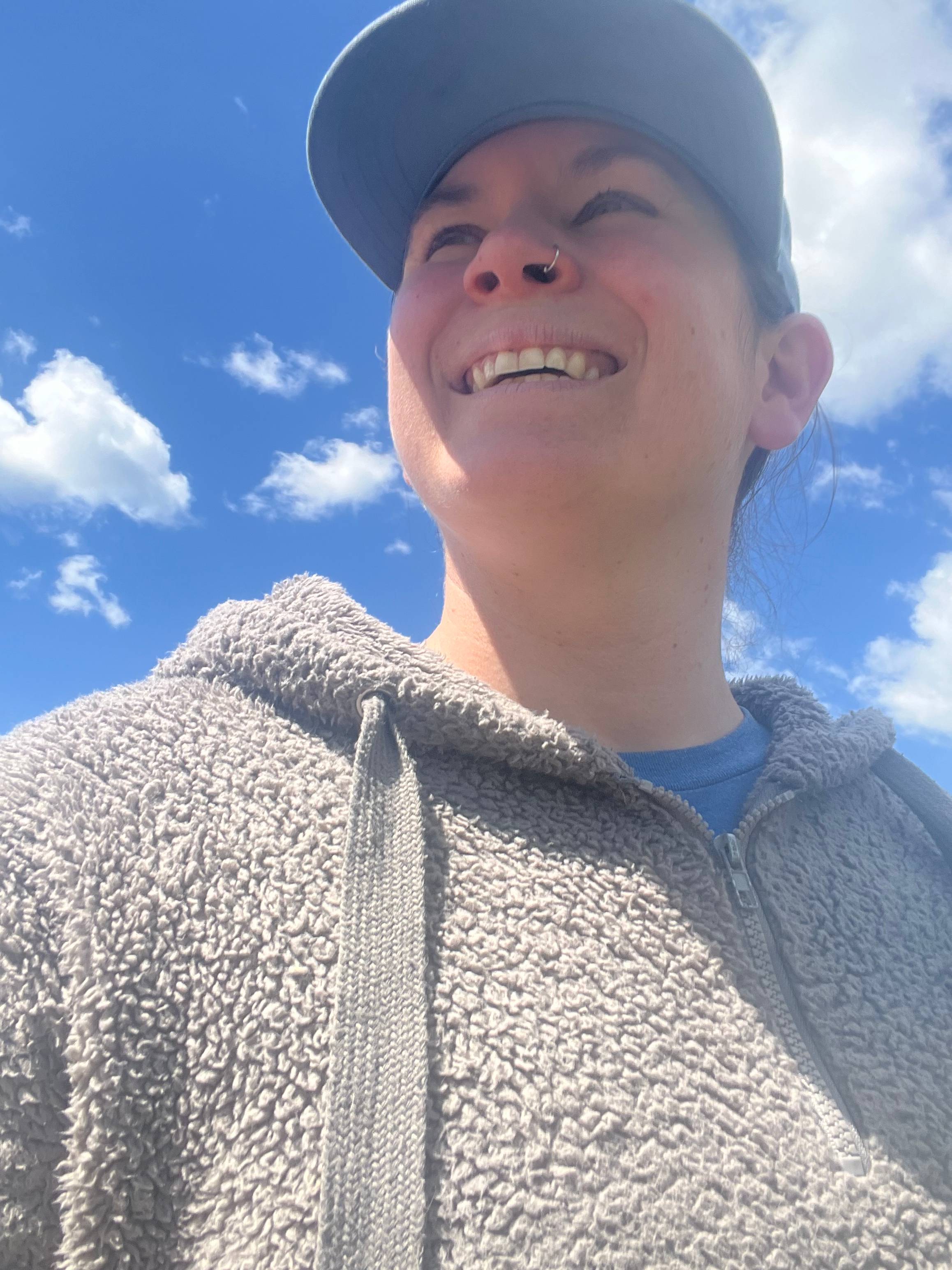 A picture of Kristen smiling looking up.