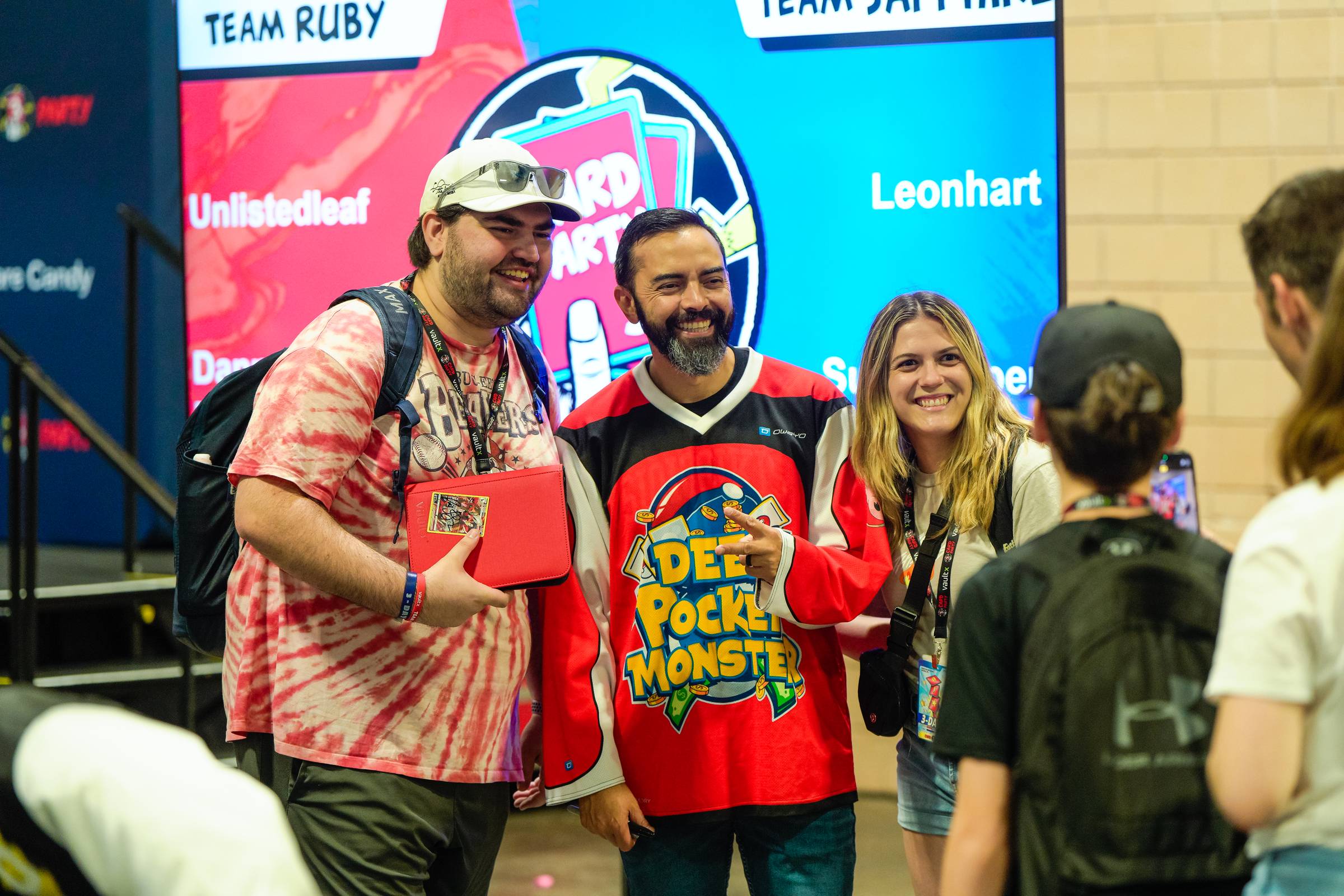 Pat posing for a photo with guests at the Card Party event