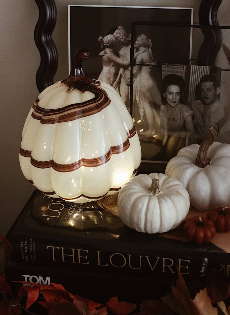 Decorative pumpkin with lights and small pumpkins