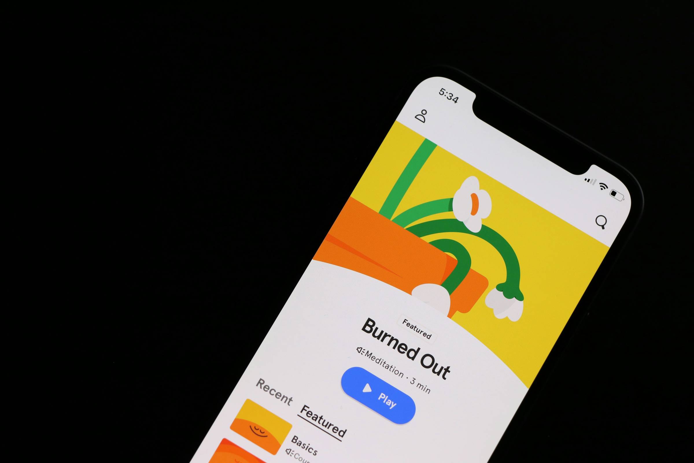 picture of a smart phone playing a track called "Burned Out"