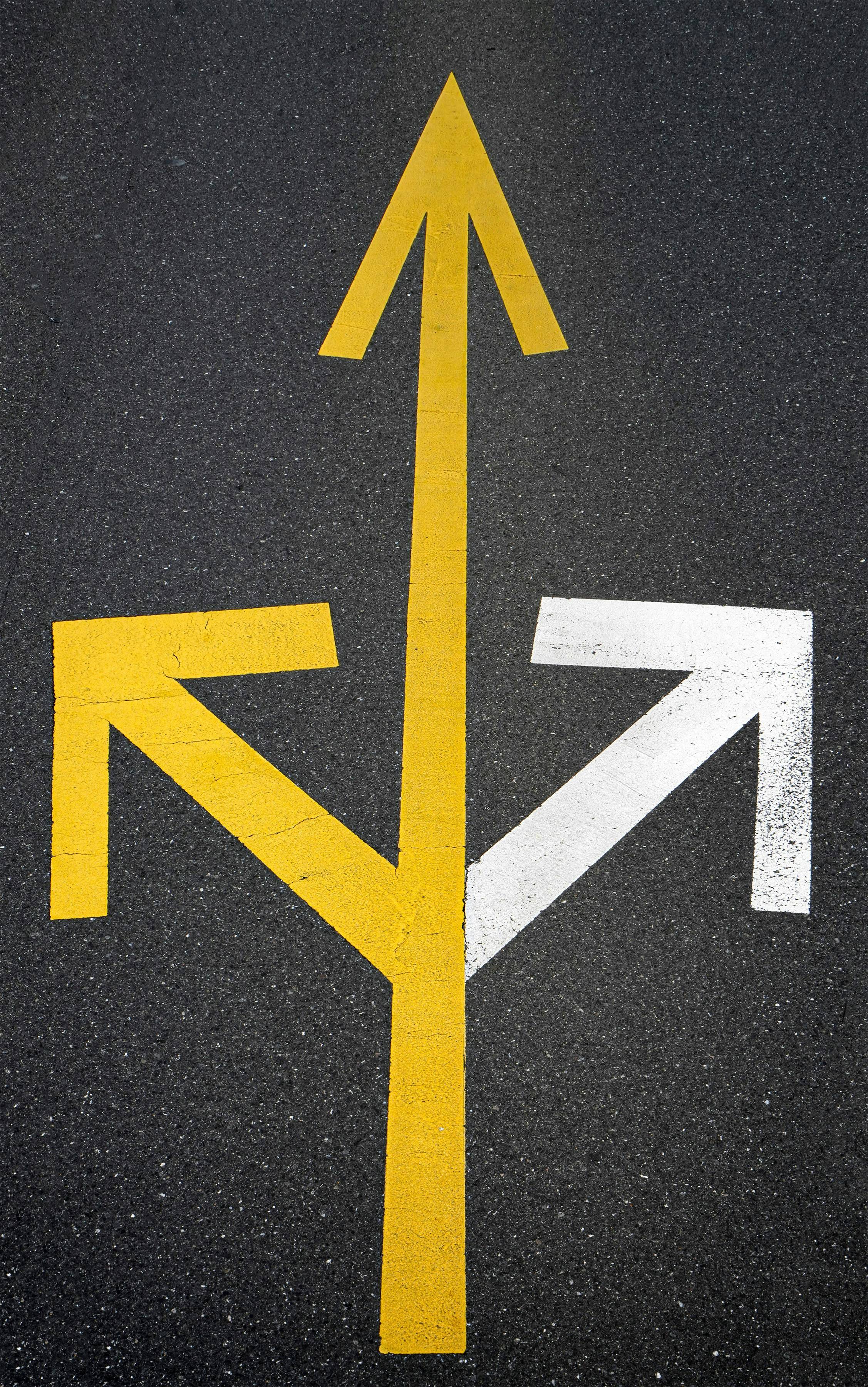 arrows painted on the ground pointing left, right, and forward