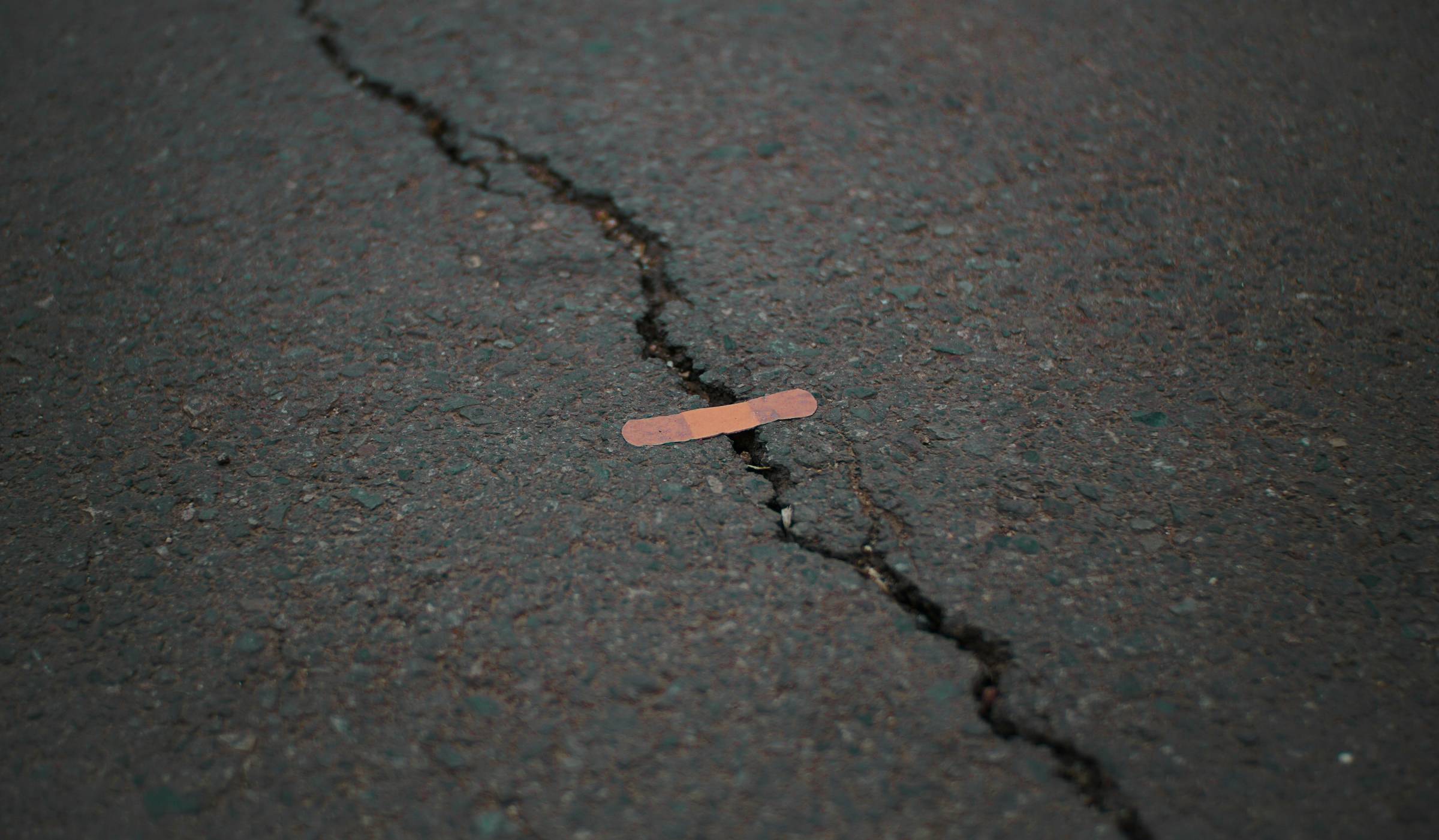 bandaid on concrete surface crack