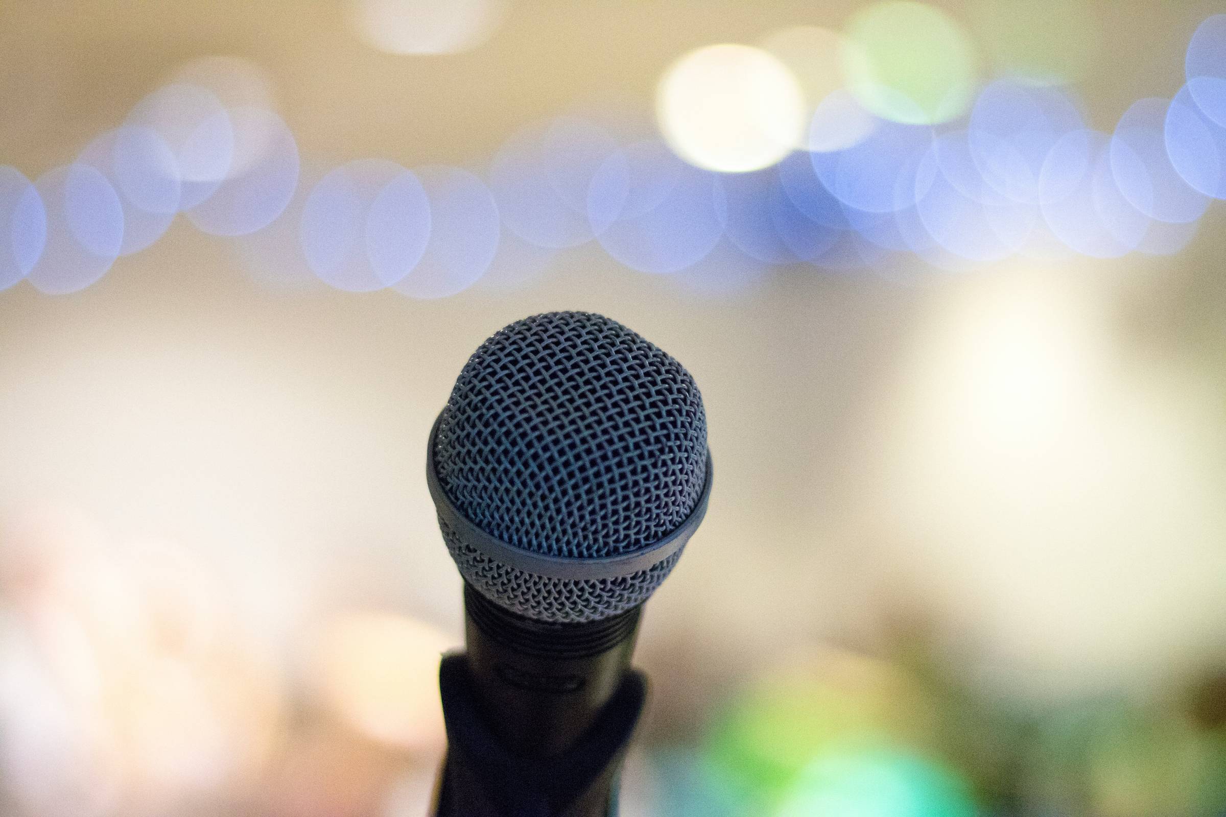 close up of a microphone and background out of focus
