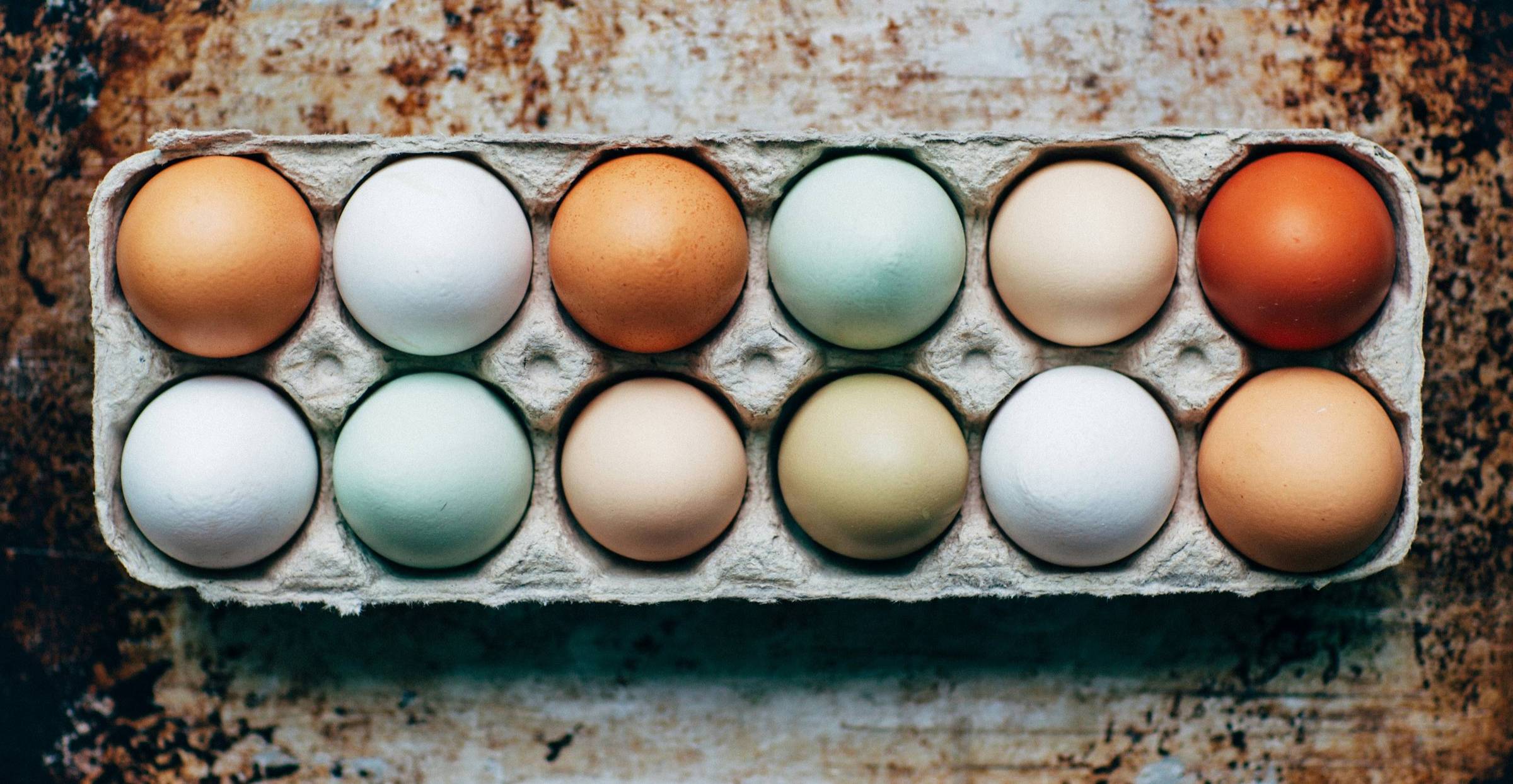 carton of eggs of different colours