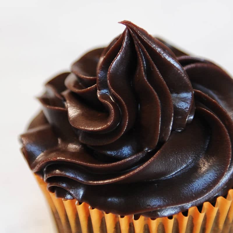 close up of piped ganache on a cupcake