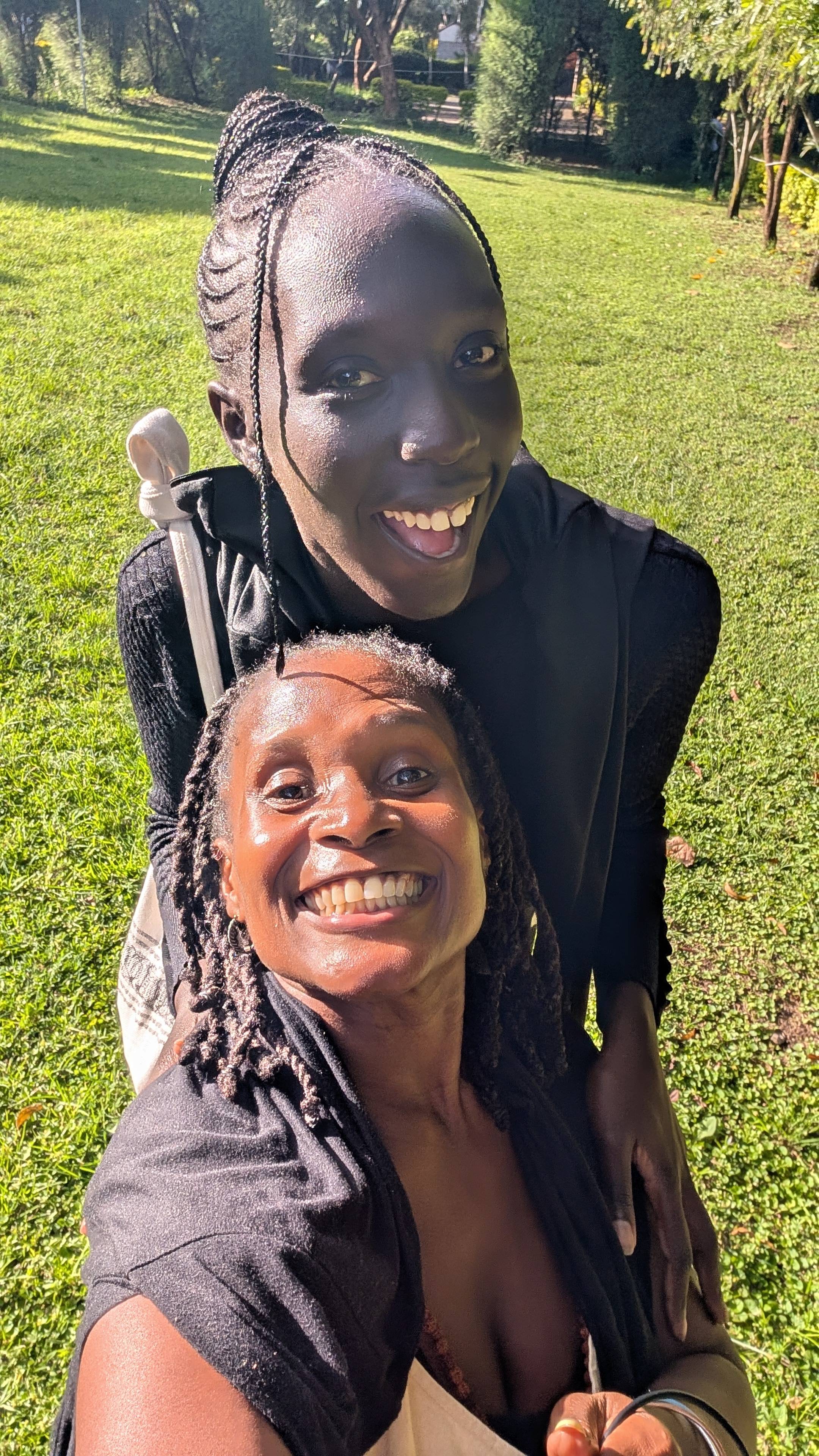 A woman standing outdoors in bright sunlight, looking upward with a peaceful, trusting expression, symbolizing guidance, provision, and divine timing.
