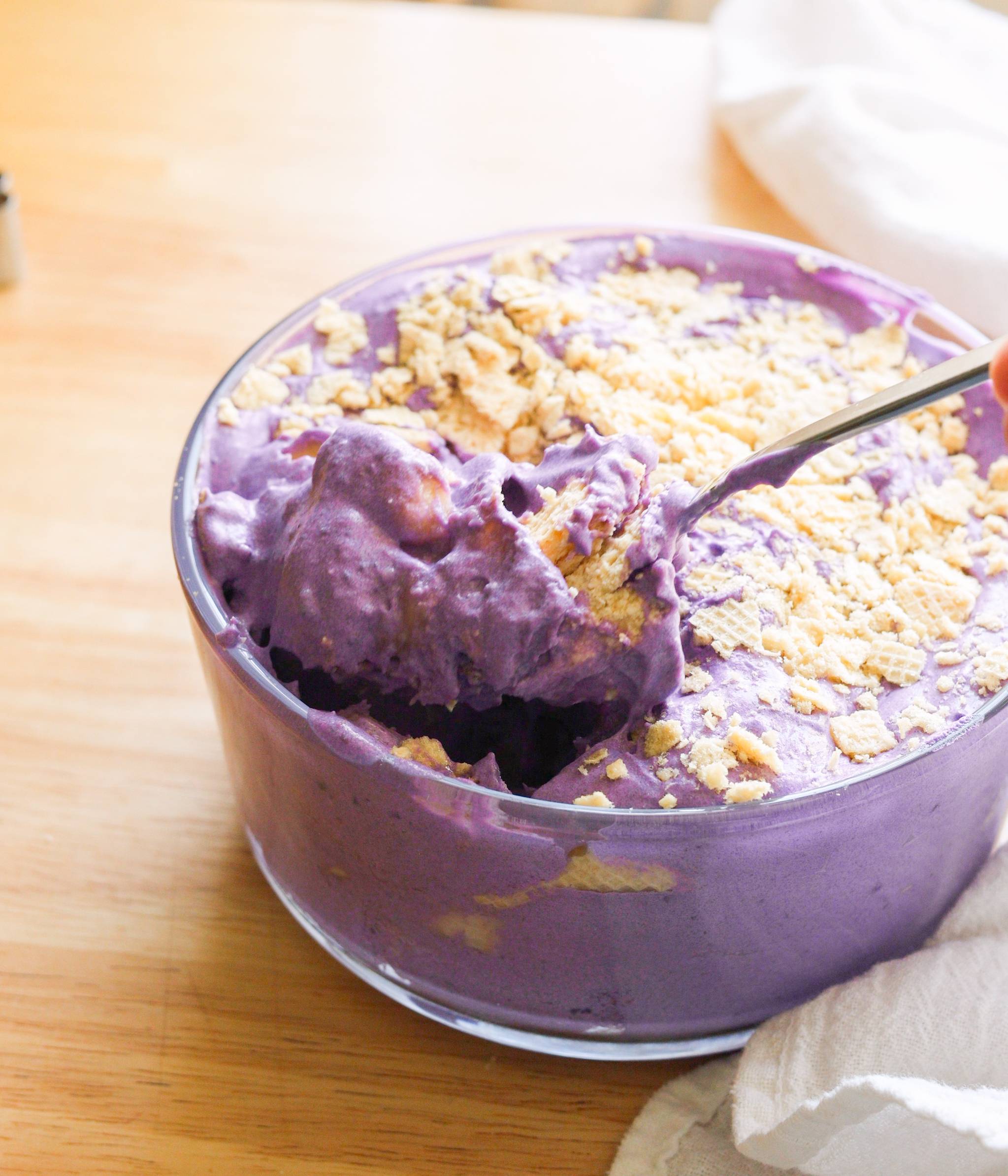 Ube banana pudding in a glass container.