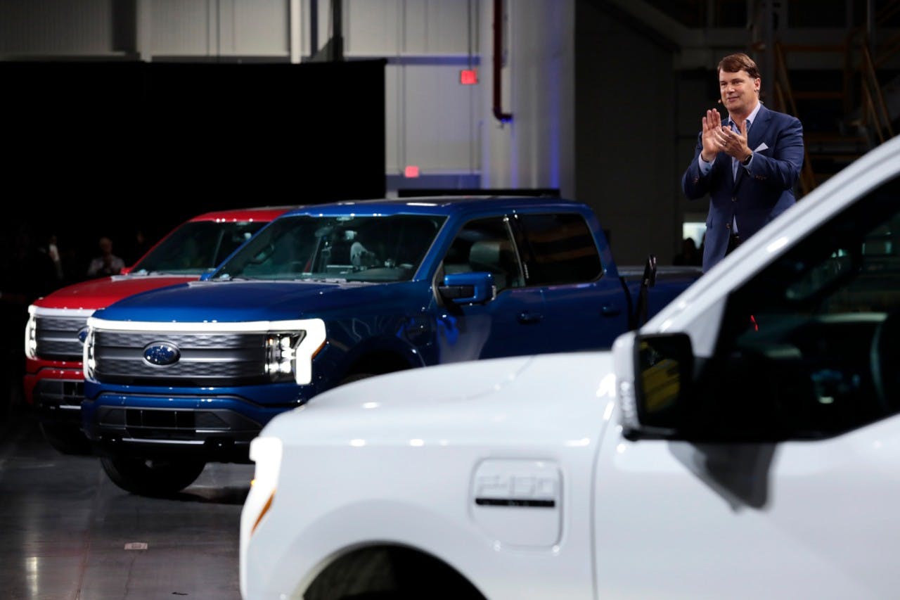 Farley next to the F-150s