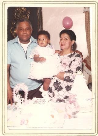 Jessica with her parents. Age 11 months.