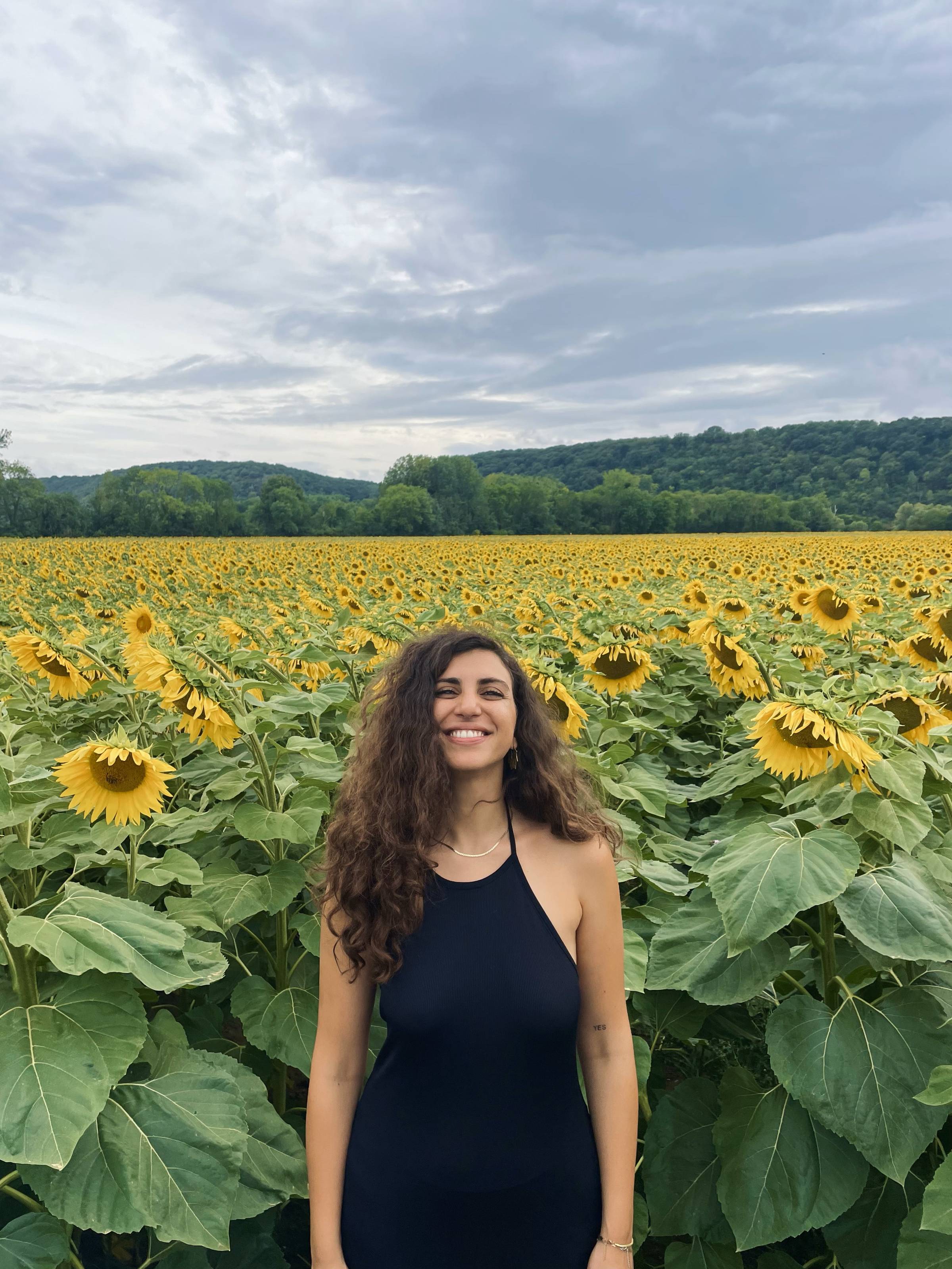 Eva Ieridou in a sunflower field