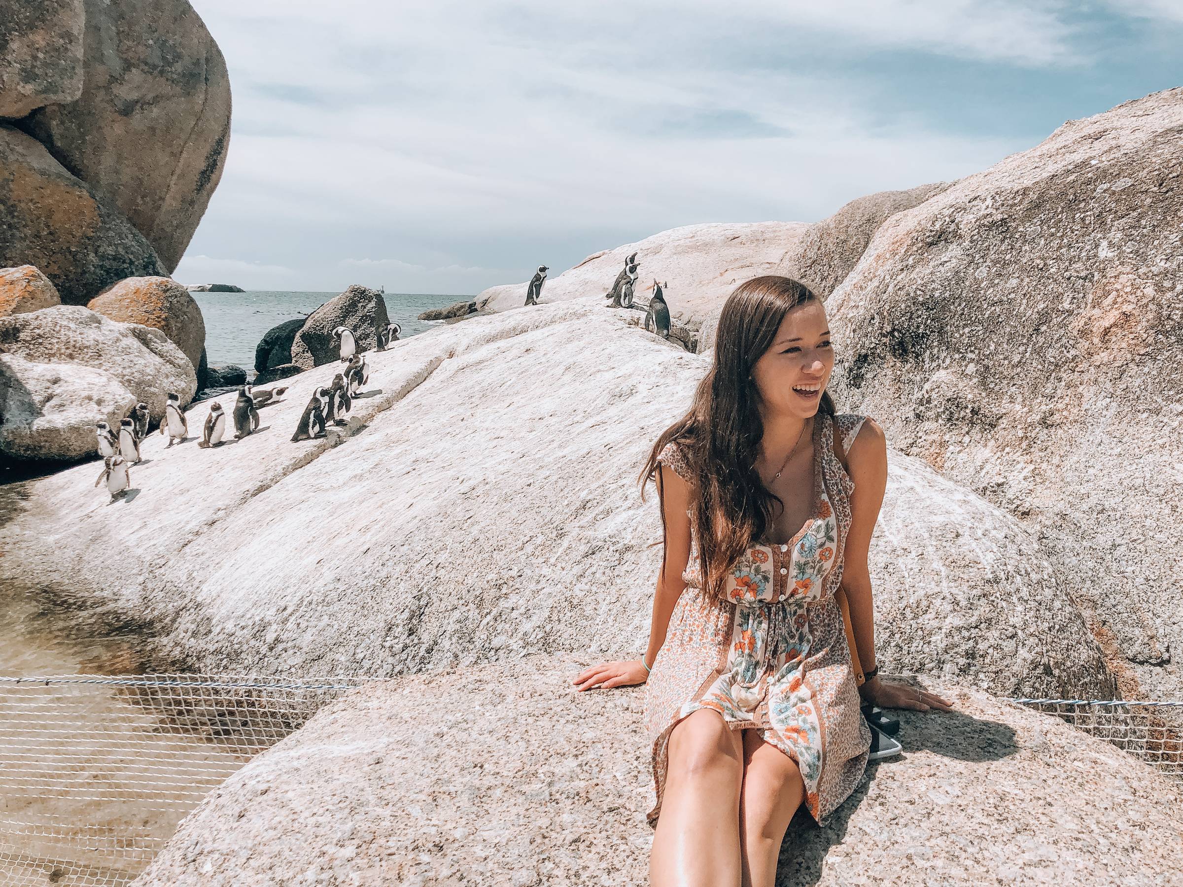 Steph Smith on a beach with penguins