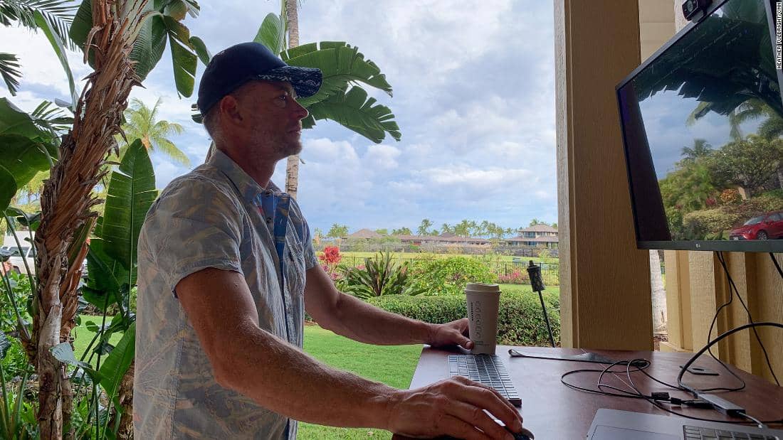 Man working from an outdoor desk setup