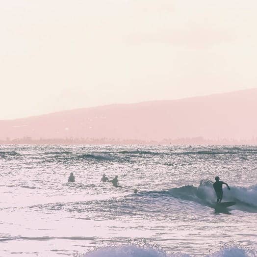 person riding surfboard