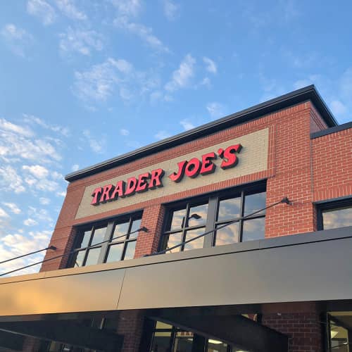 Exterior Trader Joe's with clouds in the blue sky.