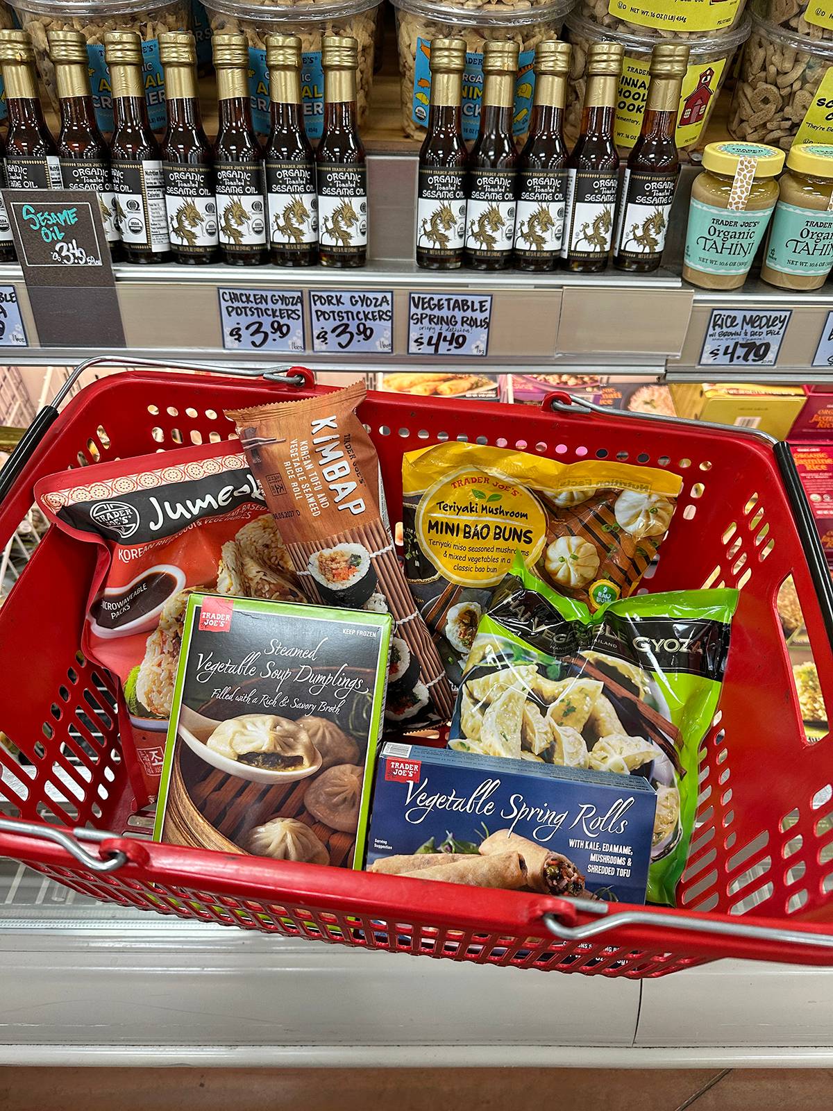 Asian Trader Joe's appetizers in a shopping hand basket.