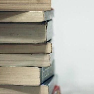 assorted books on wooden table
