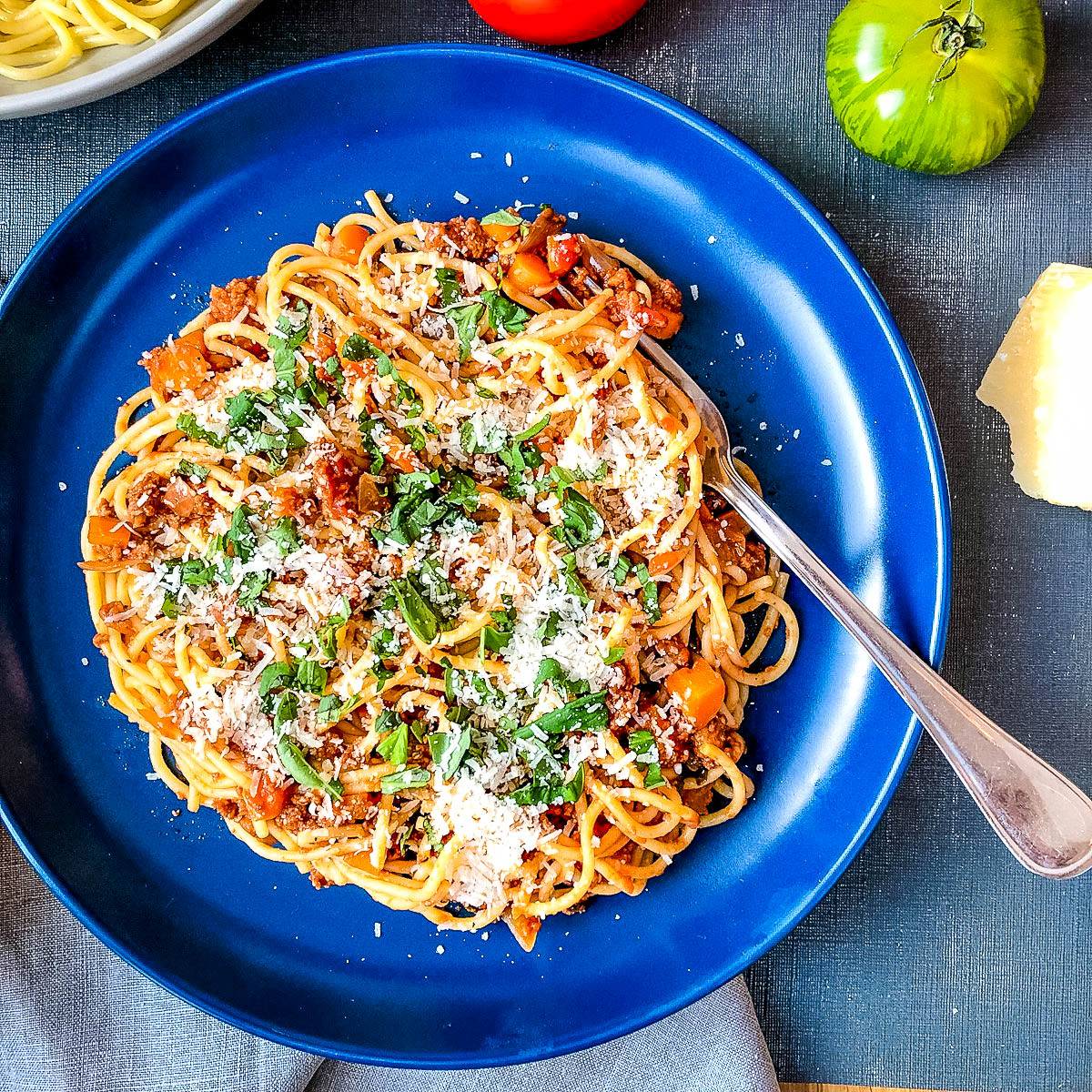 quorn spaghetti bolognese topped with cheese