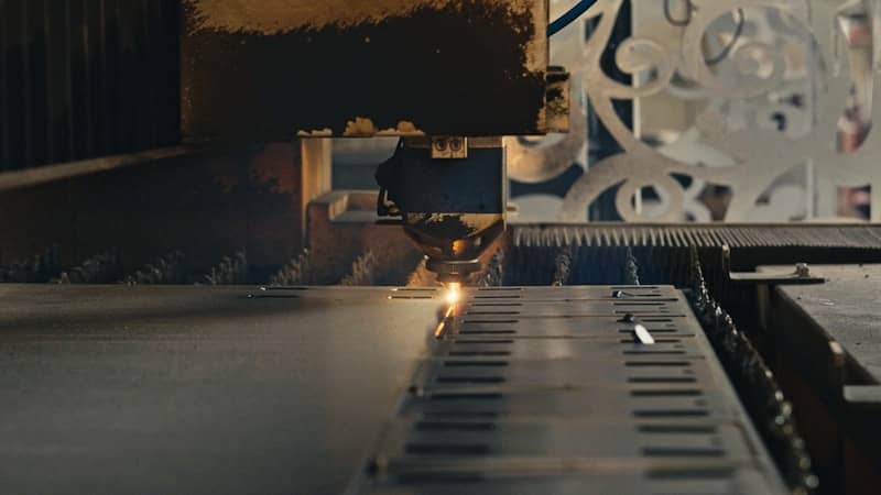 A close up of a machine cutting a piece of metal