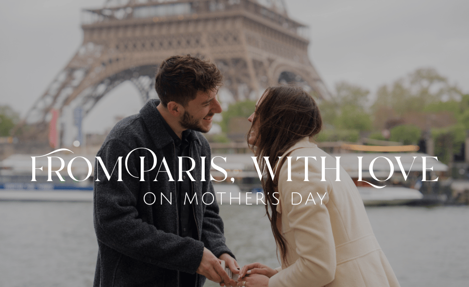 A young couple in front of the Eiffel Tower
