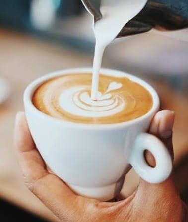 person making latte art
