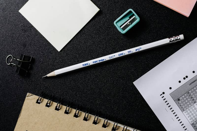white and black pencil beside white paper
