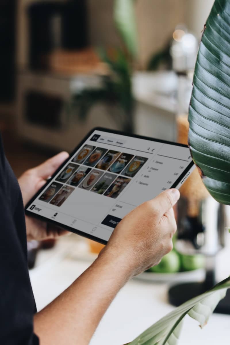 A person holding a tablet in their hands