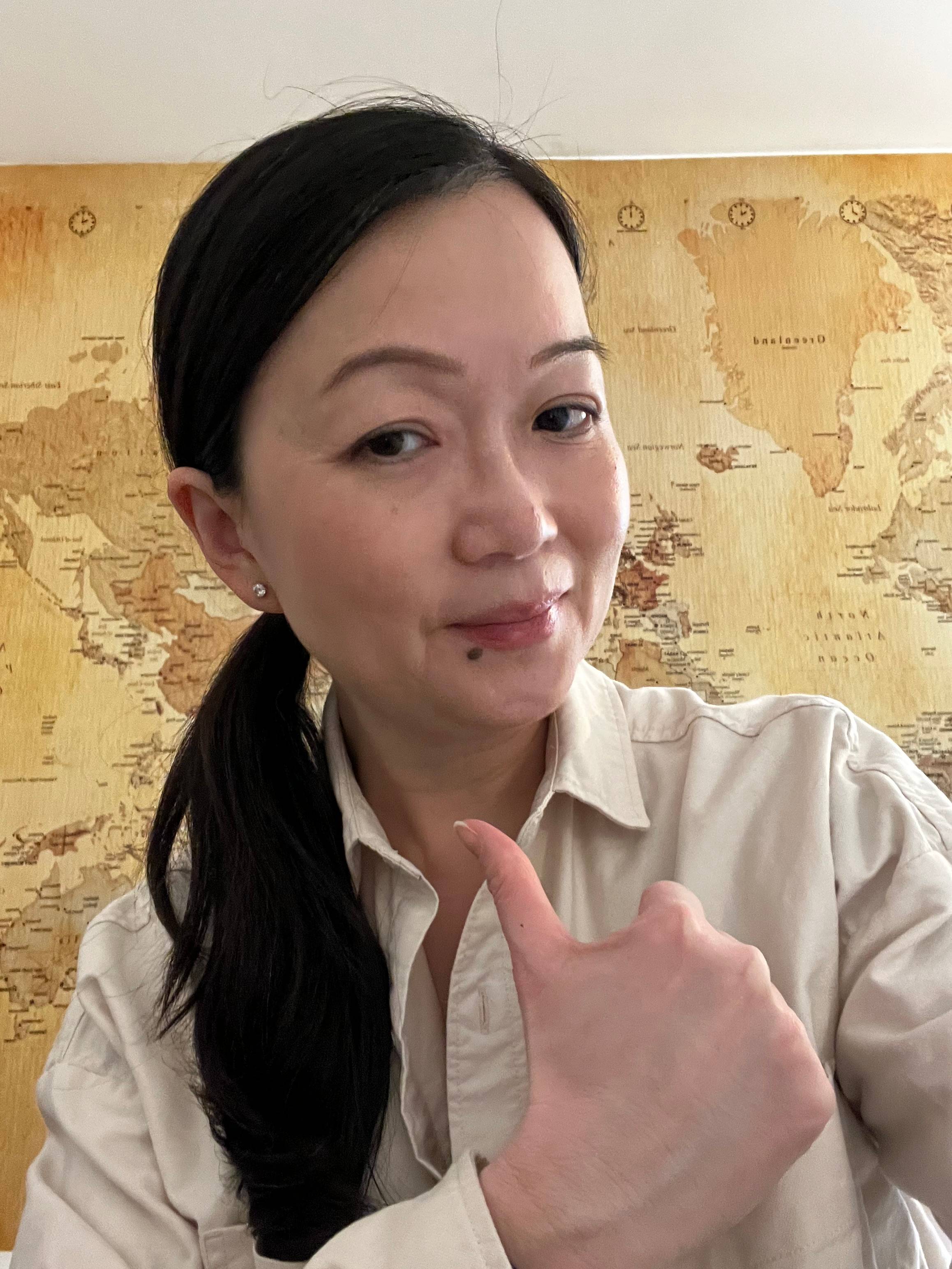 Photo showing Angeline with her thumbs up. 