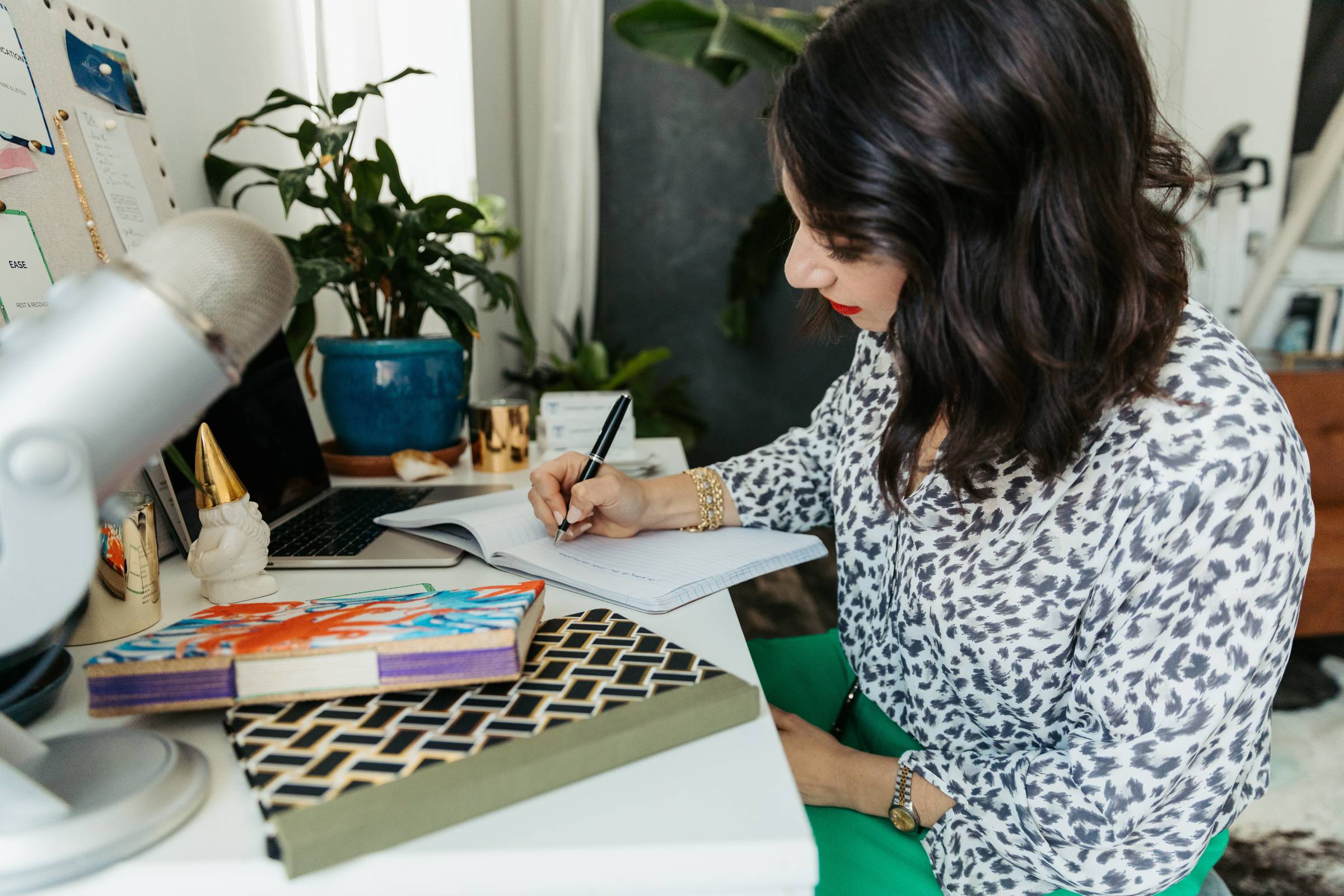 Leah writing the Gut Check newsletter at a desk