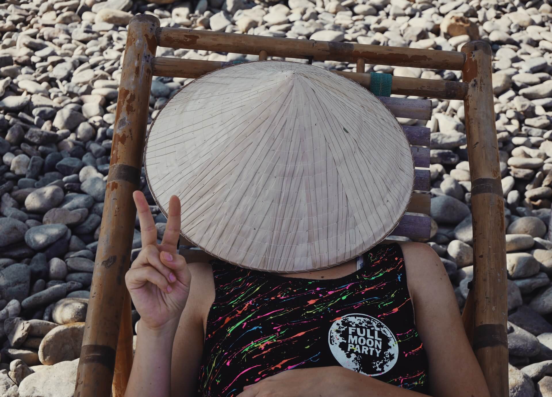 A young backpacker recovering after a Full Moon Party in Thailand