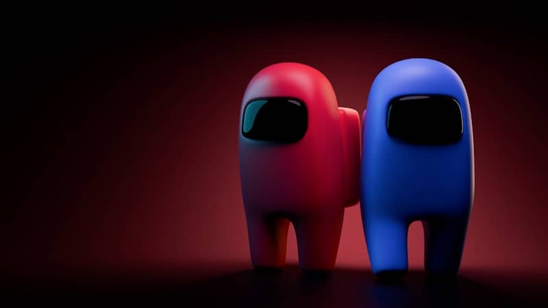 Two among us characters, red and blue, stand together.