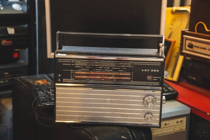 Vintage radio with silver speaker grill