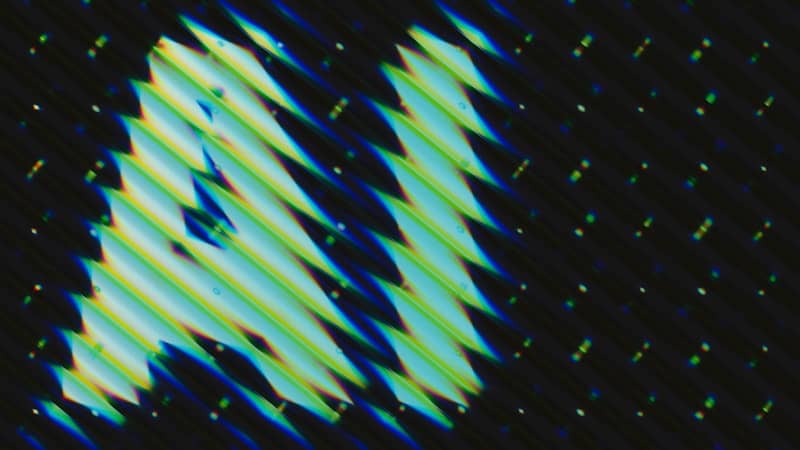 Abstract pattern of slanted lines and dots.